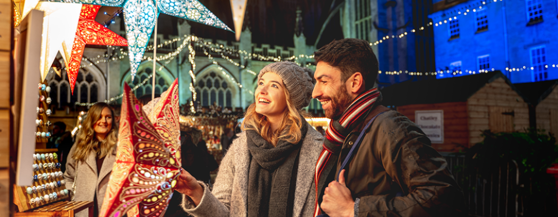 Two people marvelling at a star under the lights of Bath